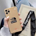 The North Face Supreme コラボ ブランド iPhone 14/14 Pro/14 Pro maxケース 激安 シュプリーム ザノースフェイス 個性 チェーン付き モノグラム ジャケット型 アイフォン14プロ マックス/14/13/12/11カバー 大人気 メンズ レディース